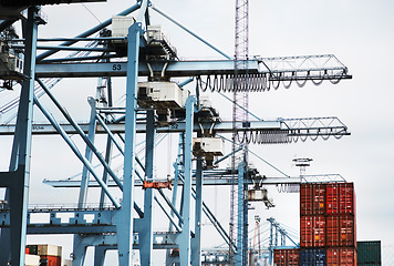 Image showing Cargo container crane, shipping logistics machine and industrial stock for global supply chain, factory manufacturing and export trade. Wholesale production, freight industry and commercial storage