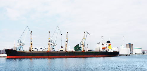 Image showing Shipping, logistics and cargo boat on ocean port in supply chain, global delivery or export industry. Travel and container ship by sea harbor of distribution, manufacturing or factory plant