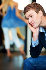 Image showing Fashion, retail and store with a tired man waiting for a woman while shopping in a clothing boutique. Patient person almost sleeping in a retail store while female consumer is spending money and cash