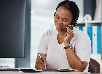 Image showing Contact us, call center and telemarketing consultant writing in notebook to help give good support and customer service. Crm, insurance and black woman working, talking and networking with client