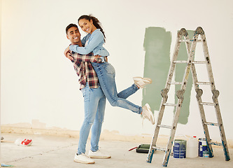 Image showing Love, a mortgage and a new home, couple paint a wall in a house green. Security, home finance and investment, a happy marriage and family fun. New beginning and bright future for young man and woman.