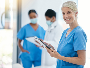 Image showing Doctor, smile and medical healthcare professional on tablet for patient records working in hospital building. Trust, consultation and medicine nurse worker with team of health experts