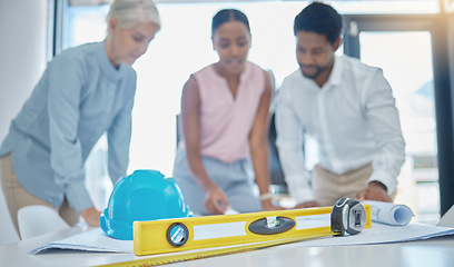 Image showing Team of engineering designer planning a building strategy in an office table with collaboration and teamwork. Construction manager and employee in meeting review blueprint paper or document on a desk