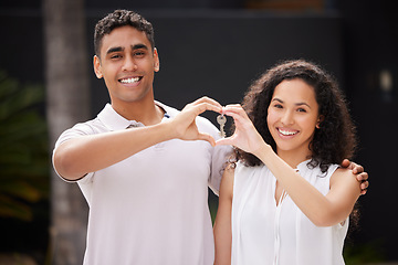 Image showing Happy couple buy real estate with key and heart hand sign and a smile together. Man and woman with keys or happiness with property rent or purchase of house, family home or apartment with love