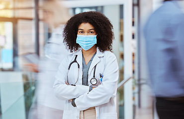 Image showing Compliance, healthcare and covid face, mask rules with proud doctor working in a hospital, ready and confident. Health care professional leader work during pandemic, focused on helping sick people