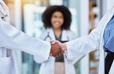 Image showing Diversity doctors handshake thank you, trust or collaboration hands for success with medical worker smile lens flare and bokeh. Healthcare employee shaking hands for promotion, innovation or research