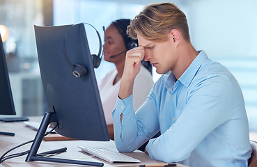 Image showing Mental health, finance and businessman with a headache due to stress, anxiety and burnout at work desk in the office. Overwhelmed, migraine and in pain person feeling tired about a bad mistake on pc