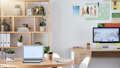 Image showing Empty business office interior with a laptop and computer on a desk or table with a professional design. An agency workspace or workplace with equipment connected to the internet or company wifi