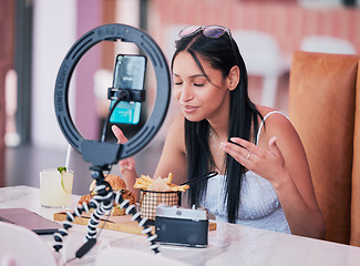 Image showing Social media influencer, smartphone and ring light for new fast food restaurant test for internet, web and followers. Creative online communication with digital mobile tech for startup video blog