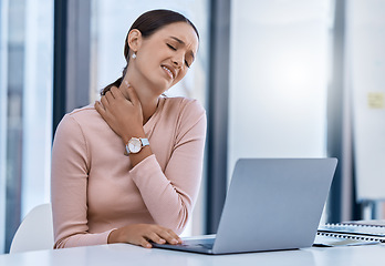 Image showing Stress woman suffering from neck pain working on a laptop in a modern office. Corporate professional with bad posture and an injury. Business SEO worker with discomfort from long hours at a desk