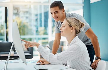 Image showing Manager consulting an employee about an online project on a computer in her corporate office. Business people working on idea, solution and strategy while doing research on internet with technology.