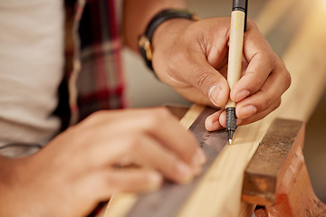 Image showing Working handyman, carpenter and building construction worker with wood for a maintenance job. Builder or contractor hands doing measure work for a home improvement project with tools at a workshop