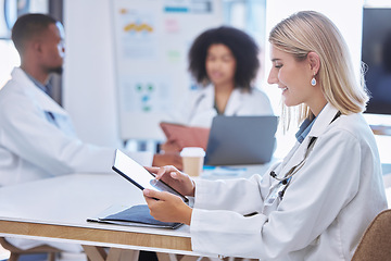 Image showing Teamwork, innovation and doctors working on digital tablet in a meeting or conference, reading and research together. Health care workers collaboration on online search for breakthrough or discovery