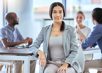 Image showing Business woman, office worker and employee working with motivation, smile and career success in a startup company with team of staff. Portrait of a happy, content and young professional in an agency