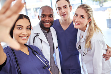 Image showing Team of doctors take a selfie together after success in the surgery emergency room in a hospital office. Happy, teamwork and young healthcare workers ready to help people with medical treatment