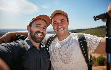 Image showing Friends, brothers or hikers taking a selfie while hiking outdoors in nature sharing the experience on social media. Active, fit and athletic men take a picture or a photo while trekking