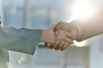 Image showing Handshake, greeting and meeting business people in an agreement or partnership in unity, trust and support. Closeup of corporate professionals hands in collaboration or thank you gesture