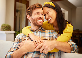 Image showing Diversity, love and happy couple in living room sofa together, sharing intimate moment at home. Freedom, smile and relax young married man embracing woman bonding on marriage anniversary