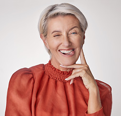 Image showing Comic portrait, quirky model or playful mature woman on gray studio background with funny facial expression, tongue or happy wink face. Silly, classy fashion and elegant stylish beauty or cool person