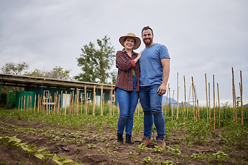 Image showing Couple working on garden, field and environment for plants, sustainability agriculture and green farming in countryside. Portrait of happy, smile and success farm worker gardening vegetable on land