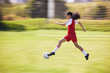 Image showing Football, soccer and running girl with a ball doing a sport exercise, workout and training. Moving and young woman athlete in a sports player team uniform runing for fitness cardio on a grass field