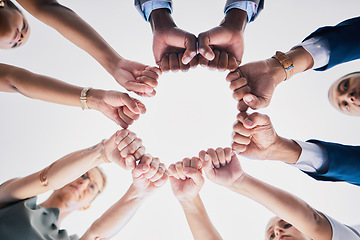 Image showing Group of business people, team building hands or fists in a circle in unity. Support, motivation and collaboration in an office partnership. Meeting success in diversity, communication and teamwork.