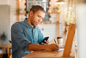 Image showing Serious, casual man entrepreneur working in restaurant cafe, calculating inventory and budget expense. Young male manager busy planning finance, accounting, tax report of his coffee shop startup