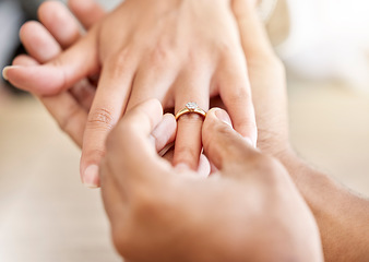 Image showing Closeup hand of proposal engagement ring after romantic, caring and loving man proposes to woman. Bonding, happy and in love couple getting engaged with diamond wedding band on valentines day or date