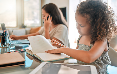 Image showing Distance learning, independent or child development of a little girl studying from home and writing in a notebook. Young child doing online education with a busy mother or single parent