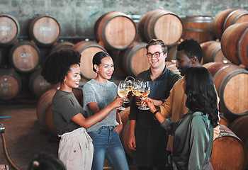Image showing Friends, wine tasting or toasting alcohol with drink glasses in local farm distillery, winery estate or countryside room. Diversity, bonding or happy celebration people together with vineyard barrels