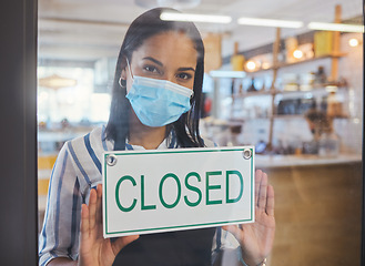 Image showing Compliance, safety and economic crisis closing store due to covid19 pandemic, sad and in debt. Small business owner frustrated about fail startup, hanging a sign on the window or entrance of shop