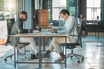Image showing Colleagues, coworkers or male employees collaborating and planning a business growth strategy together in an office. Happy corporate professionals working on a project proposal at a modern workplace
