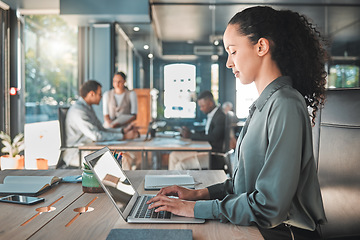 Image showing Relax, calm and serious business woman typing, writing and replying on a laptop working on a growth proposal in office. African American female employee writing and planning at a marketing agency