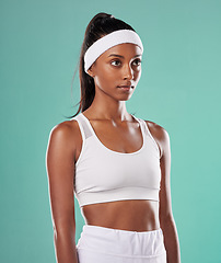 Image showing Black female tennis, badminton or squash player standing, relax and cool before competition, tournament and game or match. Athletic and fit African American sports woman with professional sportswear