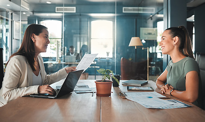 Image showing Job interview for a business woman at a hiring company talking to the HR manager about the role or position. Young female applicant or candidate in a meeting with an employer having a discussion