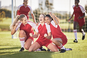 Image showing Celebrate, winning and success female football players with fist pump and hurray expression. Soccer team, girls or friends on a field cheering with victory sign, celebrating win in a sports match