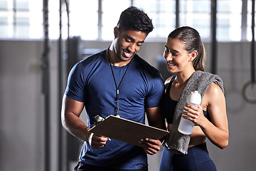 Image showing Gym subscription, personal trainer and happy client talking and ready to fill in a membership form. Fitness coach discussing training, workout plan and progress in a health and wellness facility