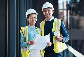 Image showing Construction, engineering and building with a contractor, maintenance worker and technician working together as a team on a development site. Engineer and builder looking at plans or blueprints