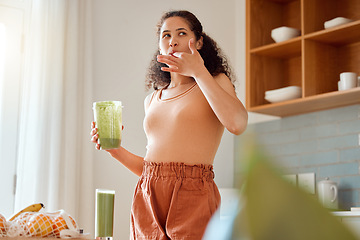 Image showing Eating, tasting and drinking a green health smoothie with a young female in a kitchen. Woman on a weight loss, organic and fresh fruit and food diet for wellness, nutrition and a healthy lifestyle