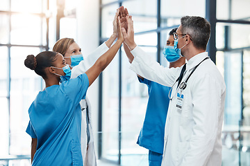 Image showing Covid doctors and nurses high five for teamwork success, collaboration and support in a hospital. Medical and healthcare professionals motivation, unity and community ready to work together as a team