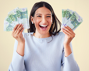 Image showing . Money, investment growth and finance success of a happy, excited and smiling woman holding cash. Portrait of a young happy female enjoying her growing financial wealth and savings with a big smile.