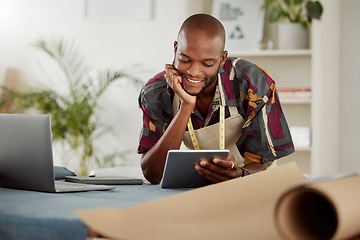 Image showing Checking an online order of fashionable style on his company website or internet app. Fashion, design and clothing industry with a trendy tailor thinking working on a tablet in his studio or workshop