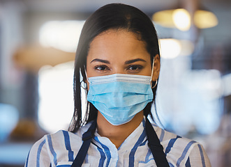Image showing Startup, coffee shop and restaurant cafe businesswoman with covid face mask, entrepreneur, worker or barista. Closeup of professional business owner, manager or employee working after the pandemic