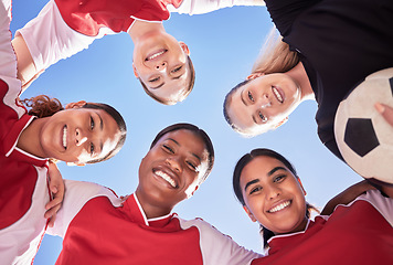 Image showing A soccer team of females only in a huddle during a match happy about winning the competition. Low angle portrait of a womens football squad standing in a circle in unity and support as game strategy