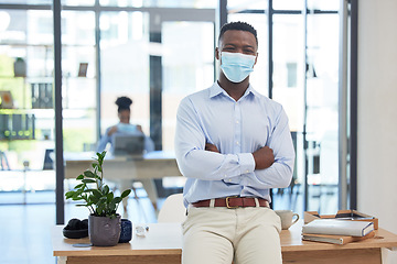 Image showing Covid, mask policy and safety in the office workplace with businessman covering his face during quarantine, lockdown or flu season. Leader, manager and professional young man at work in a pandemic.