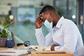 Image showing Business man tired, sick and ill with covid at work sitting at a desk and wearing a mask with a headache. A sad, worried and unhappy male employee suffering from covid19 symptoms at the workplace