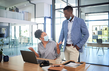 Image showing Confused businesswoman with covid face mask asking colleague to cover his face while showing wtf, what and why hand gesture in office. Concerned coworker looking annoyed during quarantine work policy