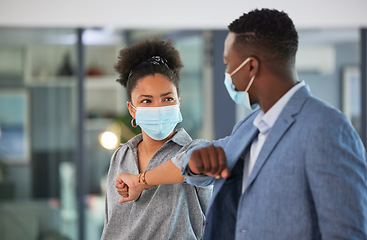 Image showing Covid, colleagues and greeting by touching elbows and wearing face masks and social distancing in an office. Friendly and diverse entrepreneurs preventing coronavirus infection spread at a workplace