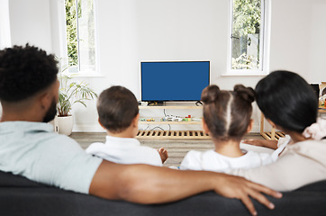 Image showing Watching tv or streaming a subscription service with green screen and chromakey together as a family at home. Rearview of mother, father and children getting ready to watch a movie or series