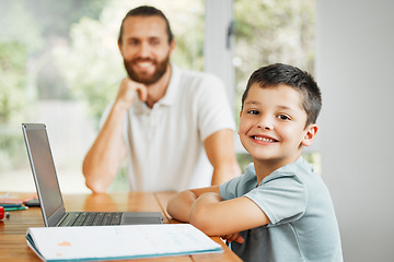 Image showing Learning, teaching and smiling little boy doing home school work online on a laptop. Happy son with caring father in the background ready to learn, study and have digital fun at the family house